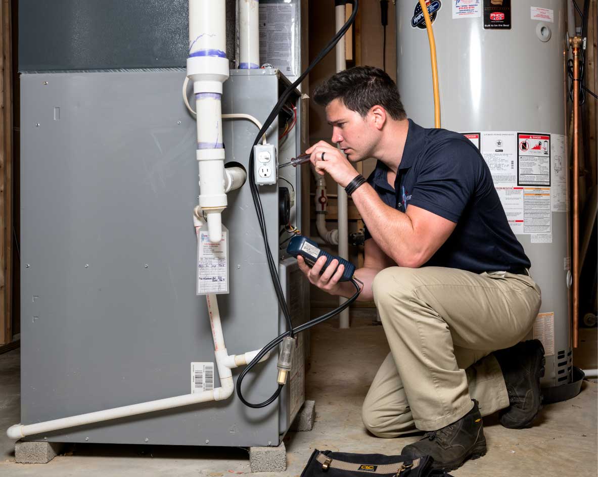 HVAC technician performing a furnace tune-up in Buckeye